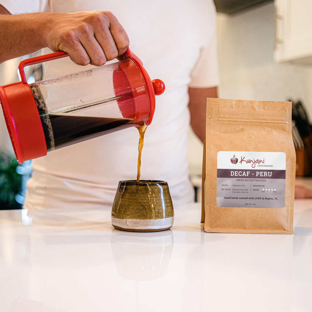 French Press pouring decaf coffee