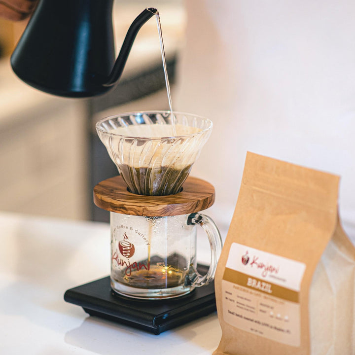 Pouring brazil coffee into cup