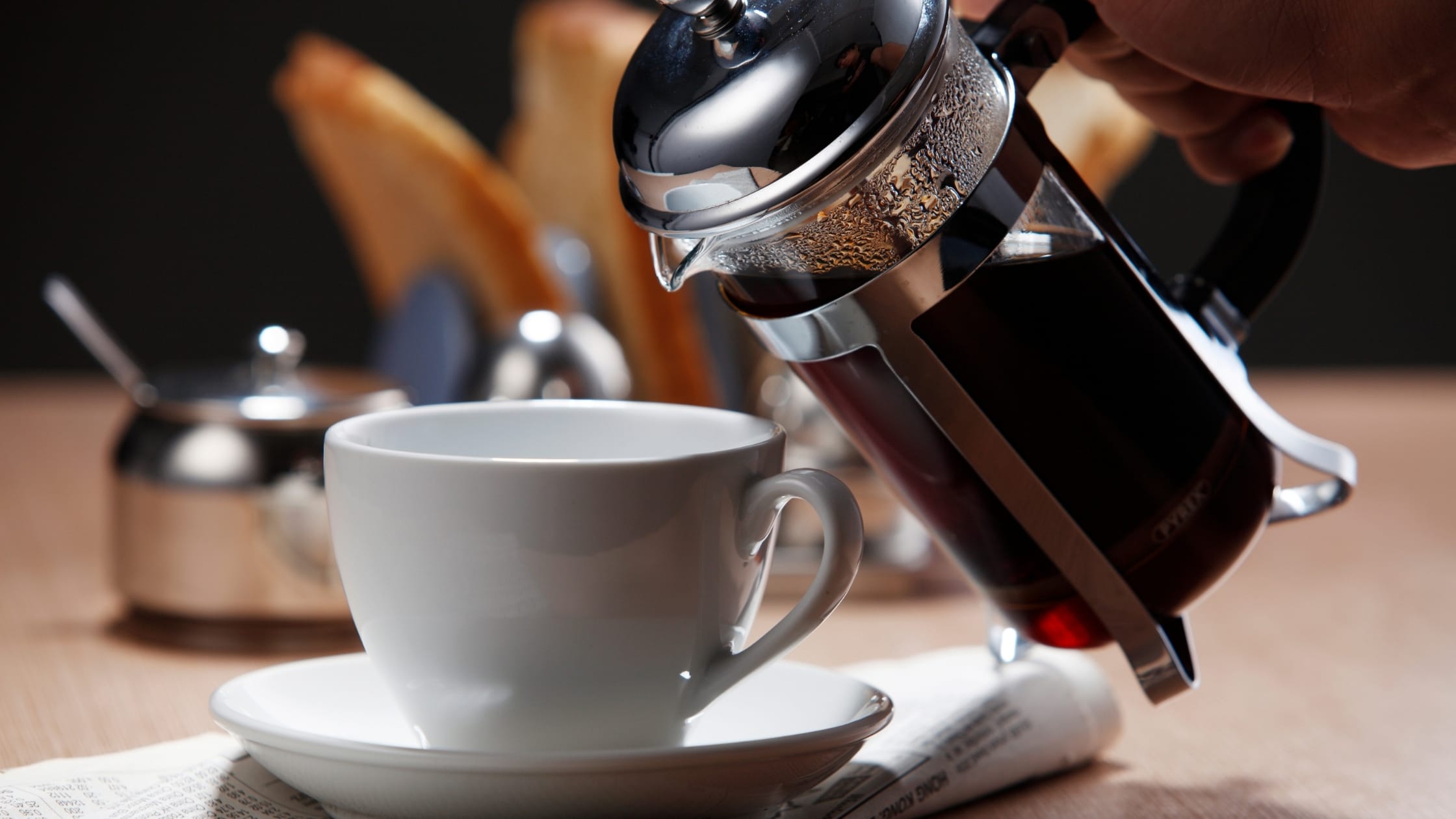 French Press pouring coffee into cup