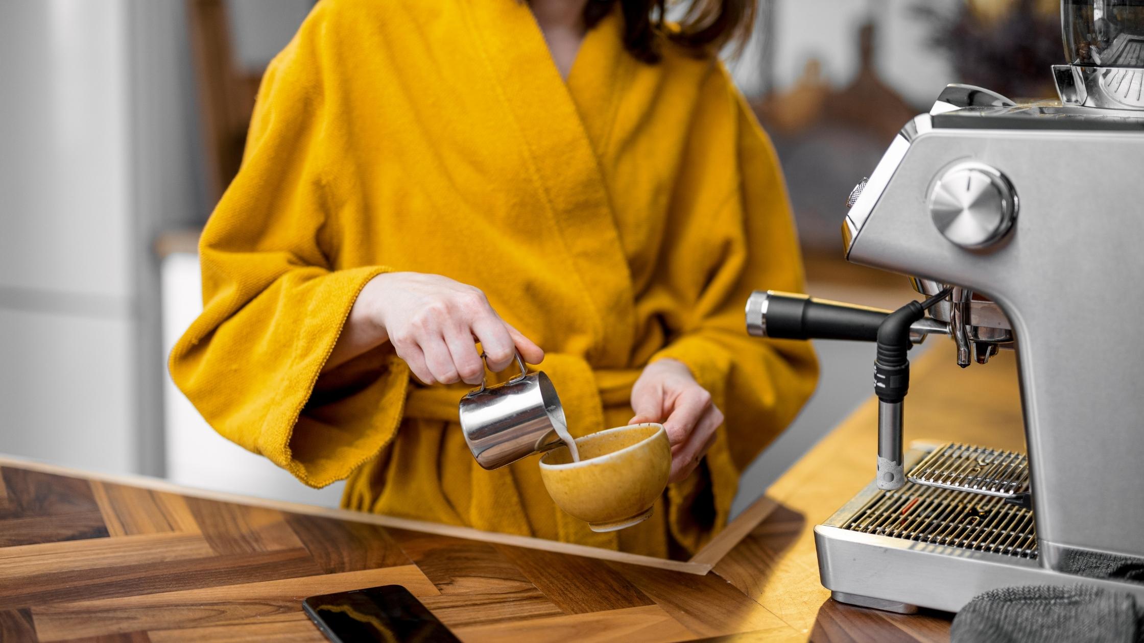 Woman making coffee at home