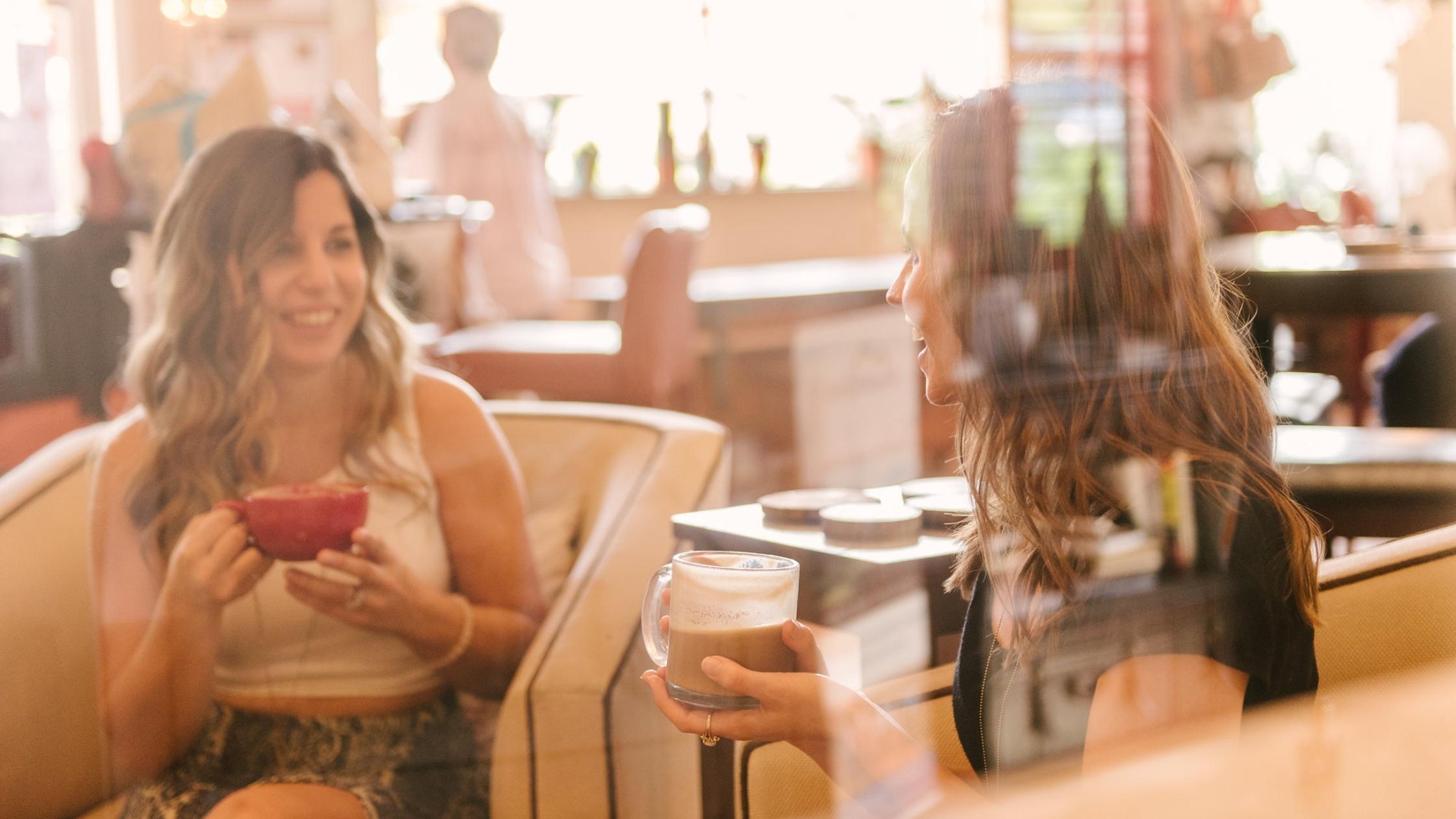 Girls drinking coffee at Kunjani in Naples, FL